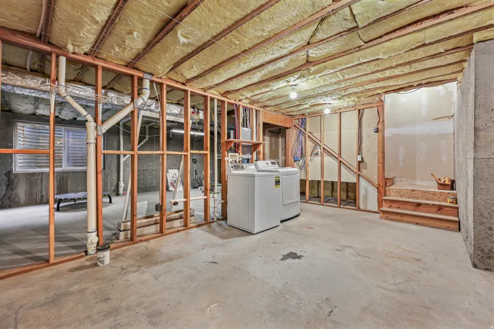 Unfinished basement and laundry area