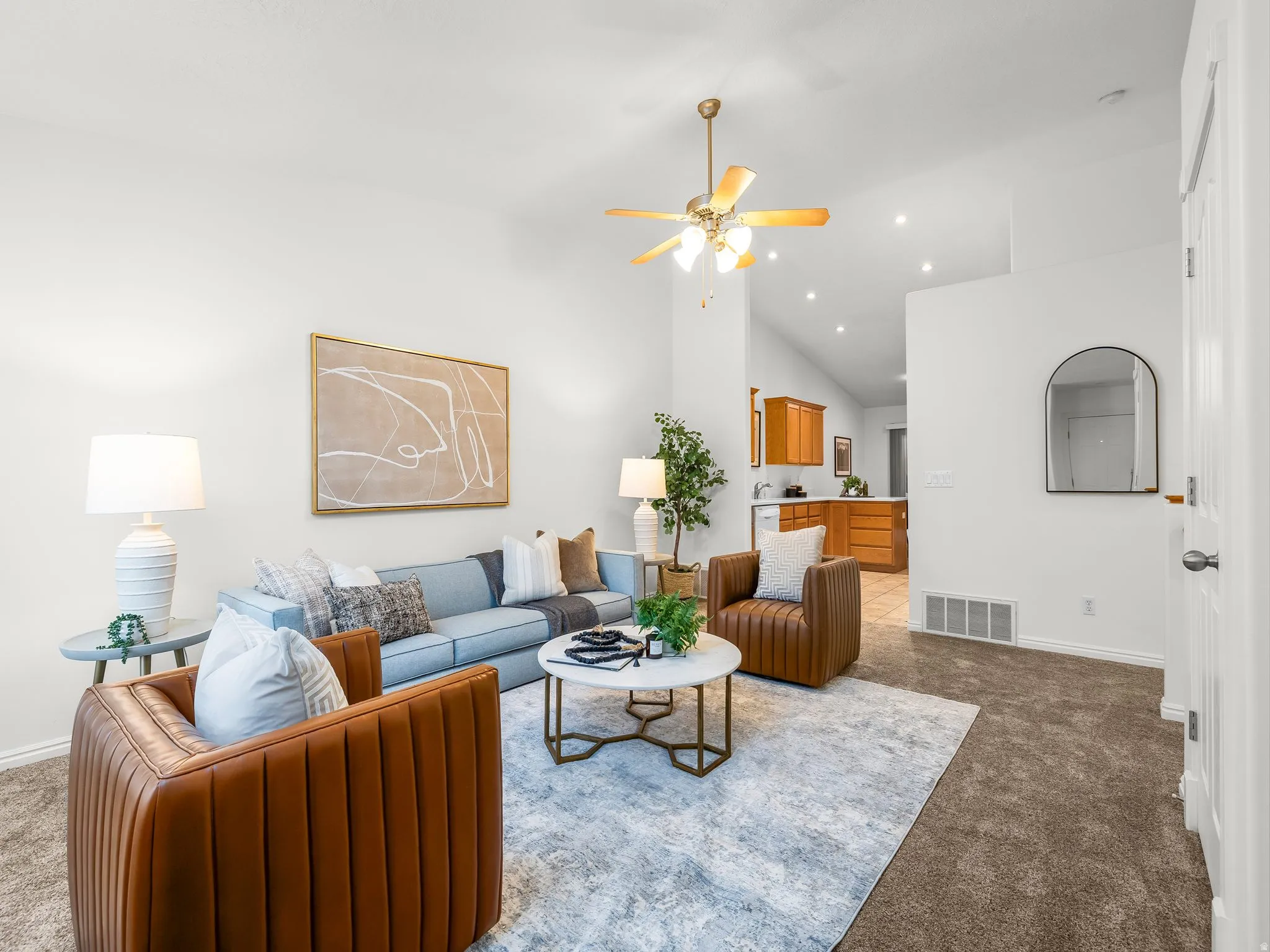 Vaulted ceilings with a ceiling fan, recessed lighting, and carpeted flooring