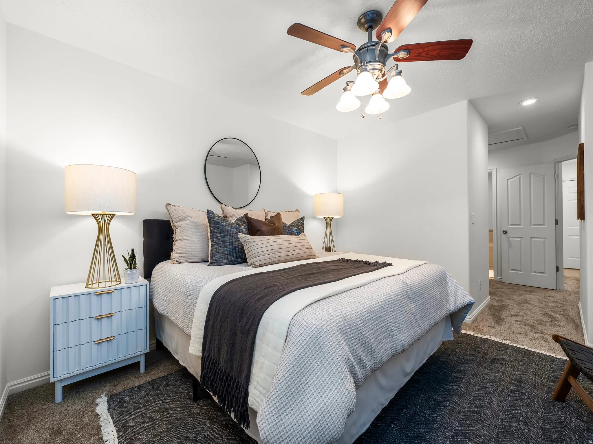 Primary bedroom with ceiling fan with light fixture, recessed lighting, white panel doors, carpet flooring