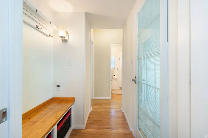 Wood-finish flooring throughout the hallway