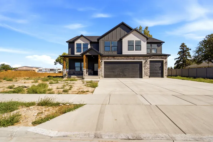 Contemporary two-story exterior with stone and siding accents