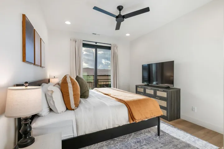 Recessed lighting and a ceiling fan with black finish