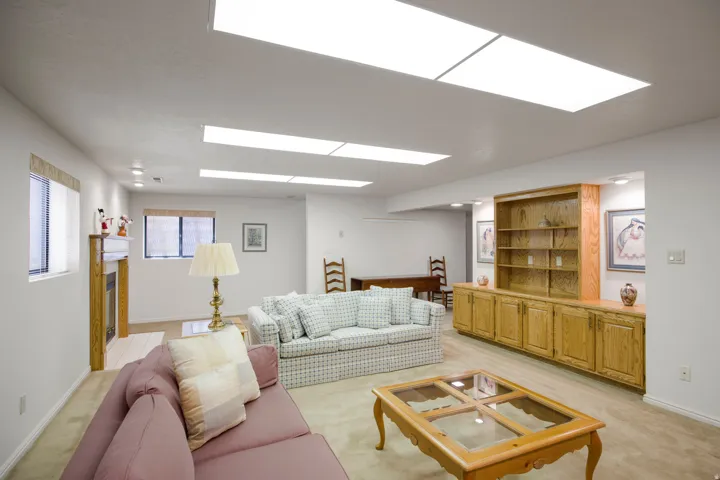 Recessed lighting and multiple panel lights illuminate the space