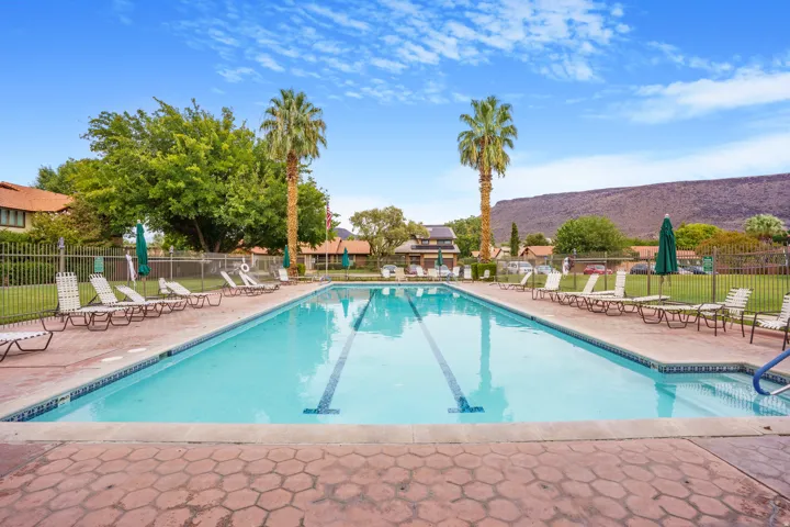 Expansive swimming pool featuring lane lines and blue tile accents