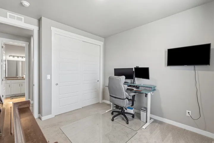 Built-in closet with multi-panel sliding doors