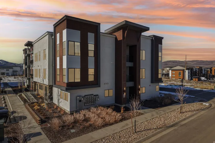 Contemporary multi-story exterior with wood-tone and light-toned siding