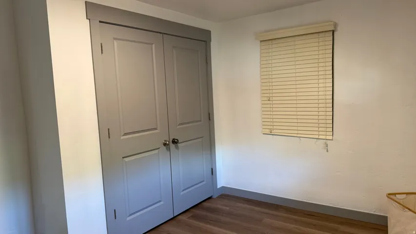 Wood-finish flooring with grey baseboards