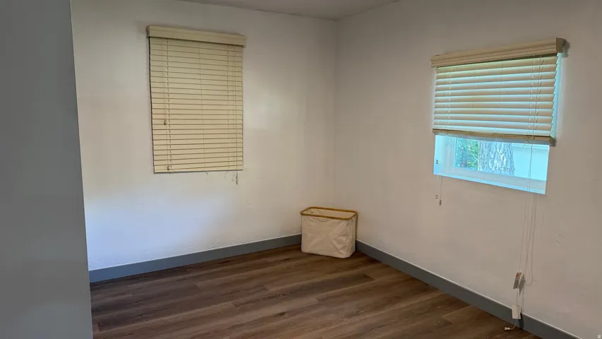 Wood-finish flooring with a contrasting baseboard