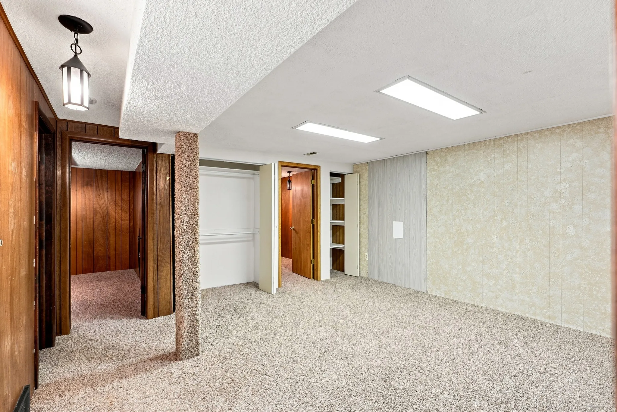 Carpeted flooring with recessed lighting and a built-in closet