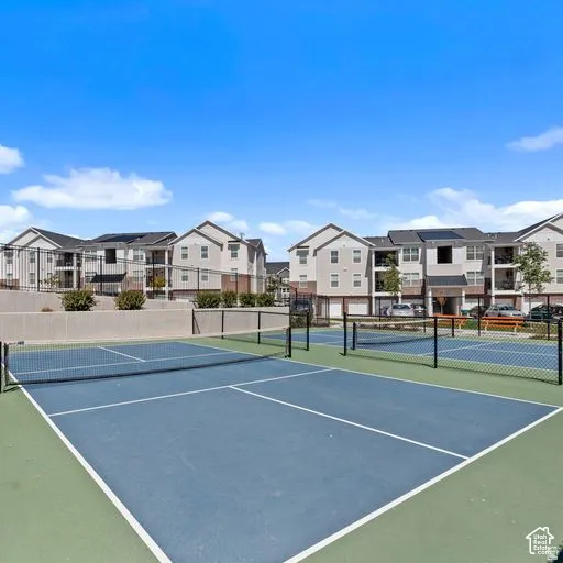 Hard-surface recreational courts with defined lines and nets