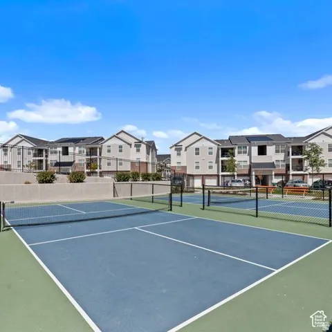 Hard-surface recreational courts with defined lines and nets