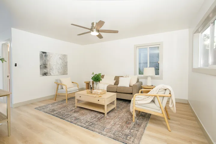 Neutral wall tones, wood-finish flooring, and white trim