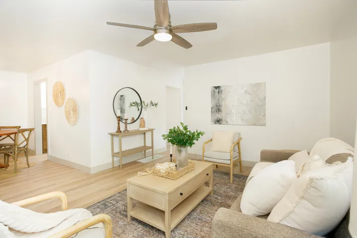 Recessed lighting, wood-finish flooring, and a ceiling fan with integrated lighting