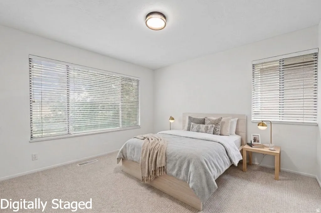 Wall-to-wall carpeting with a light neutral tone