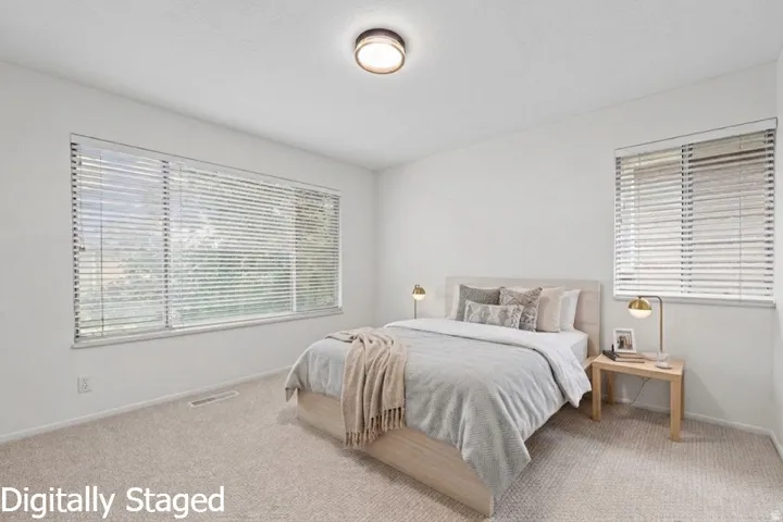 Wall-to-wall carpeting with a light neutral tone
