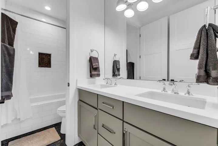 Dual vanity with integrated sinks and chrome fixtures