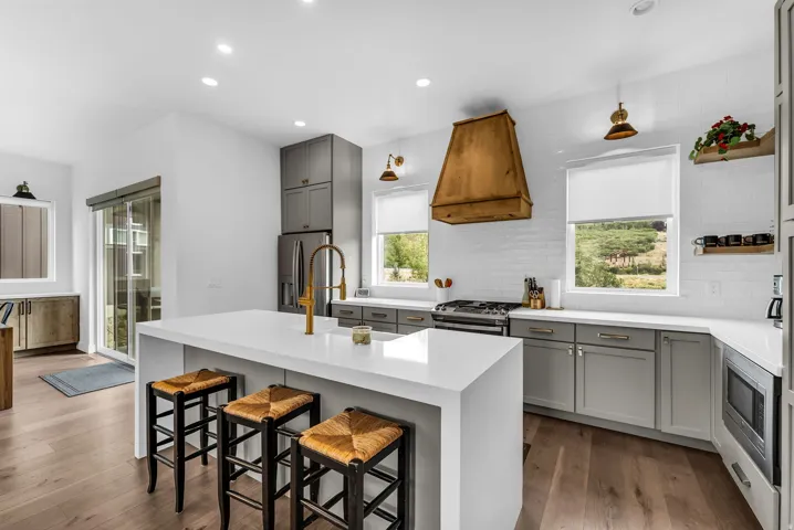 Central island with a waterfall countertop