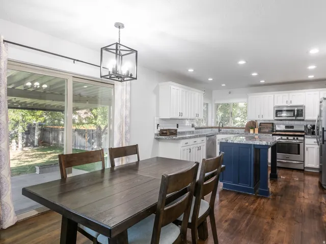 Dining area is located right by sliding doors leading to back covered patio.  Perfect for entertaining.