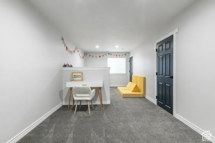 Room in lower level can easily convert to a fourth bedroom.  Blue door leads to 3/4 bath.