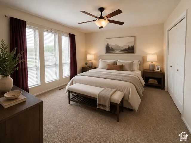 Plush carpeted flooring, a ceiling fan with integrated lighting, and a closet with bifold doors