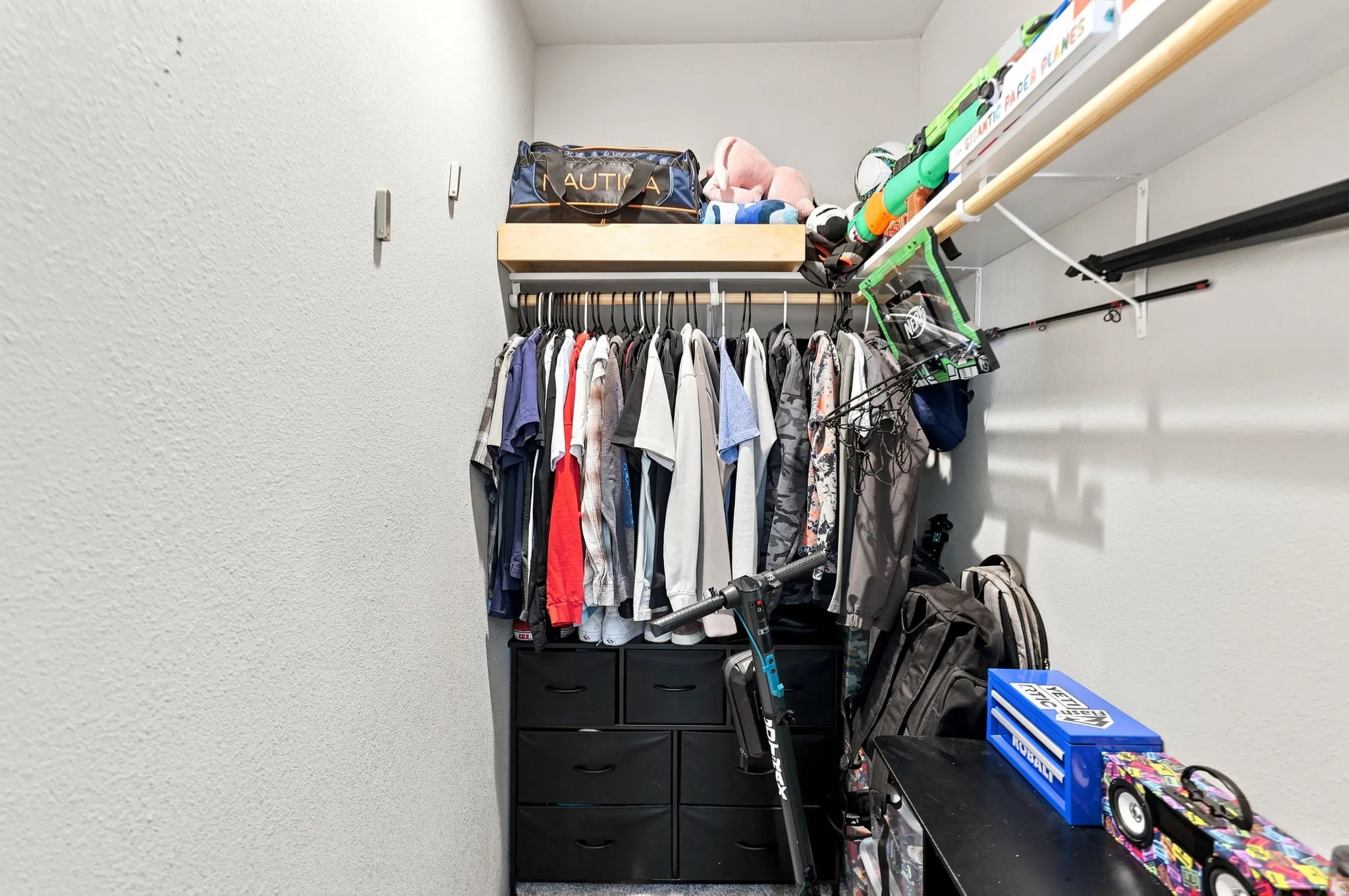 Built-in closet system featuring shelving and hanging rods