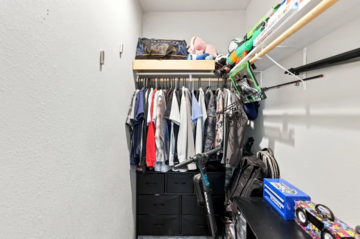Built-in closet system featuring shelving and hanging rods