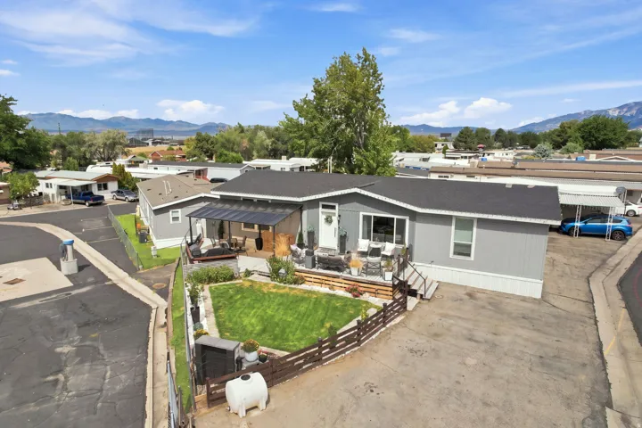 Single-story residence with a covered patio, fenced yard, and paved driveway