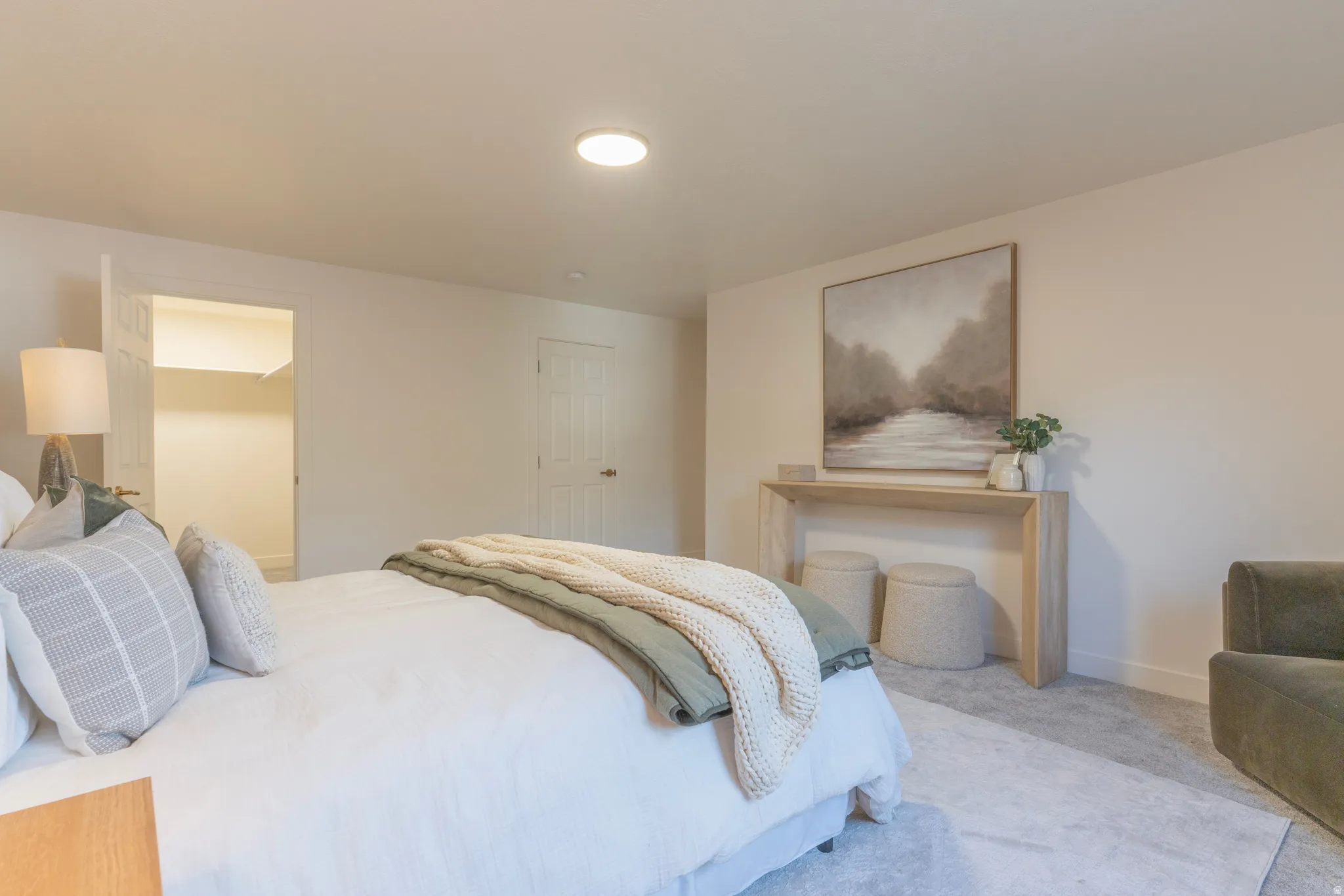Recessed lighting, wall-to-wall carpeting, and a built-in closet