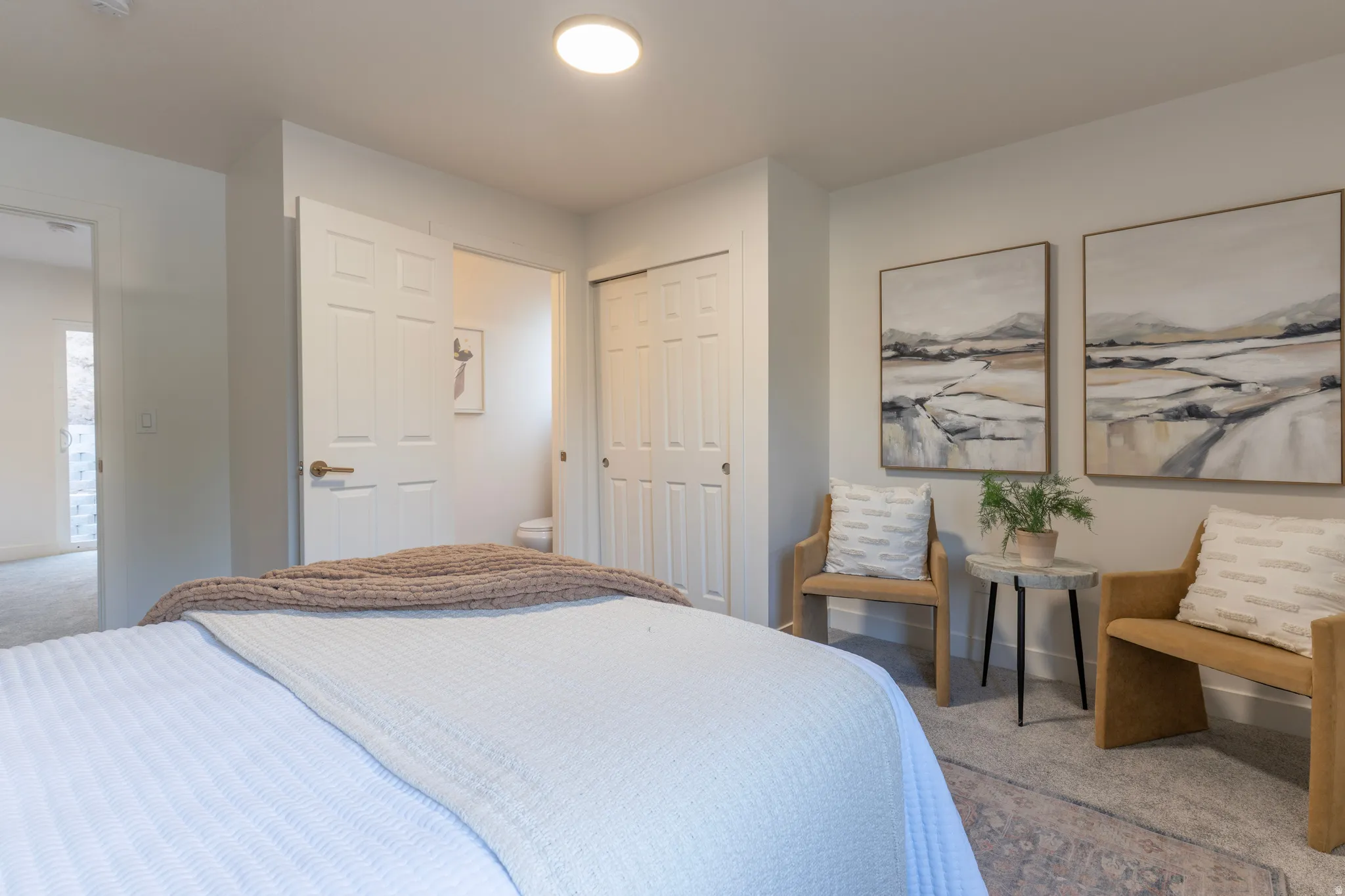 Recessed lighting, light gray wall color, paneled interior doors, and carpet flooring