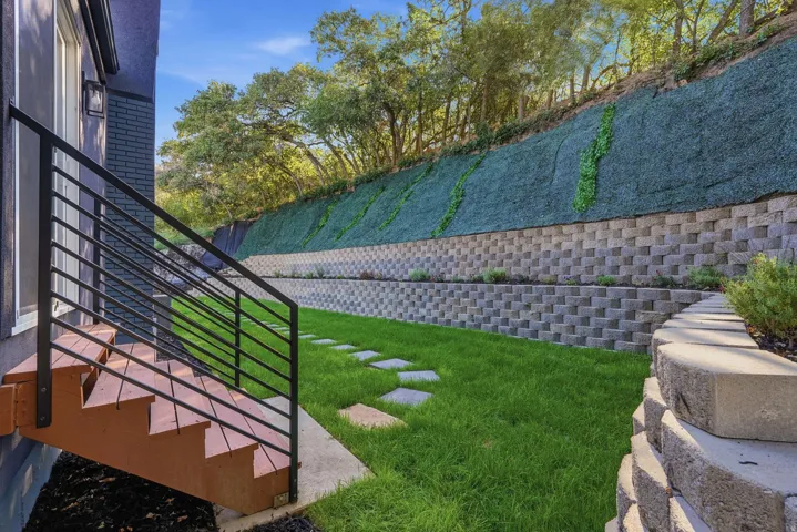 Wood-finish exterior stairs with metal railing