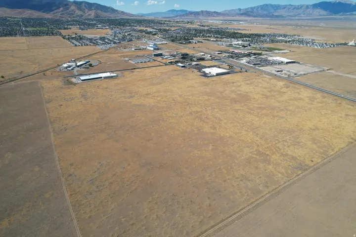 Expansive undeveloped land with a distant mountain backdrop