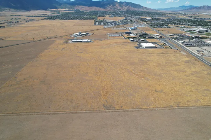Expansive undeveloped land with a distant mountain backdrop