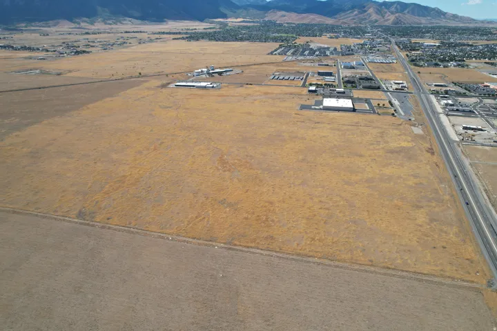 Expansive undeveloped acreage with significant frontage along a major multi-lane highway