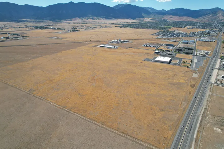 Expansive land parcel with surrounding developed areas and a visible highway