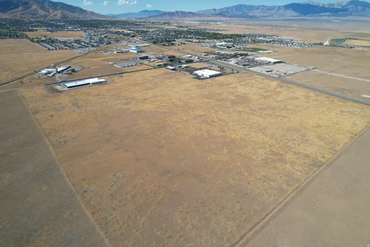 Expansive undeveloped land with a distant mountain backdrop