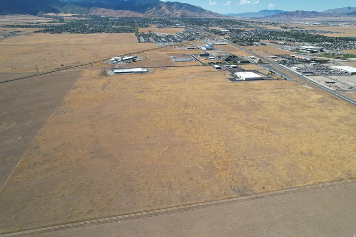 Expansive undeveloped land with a distant mountain backdrop