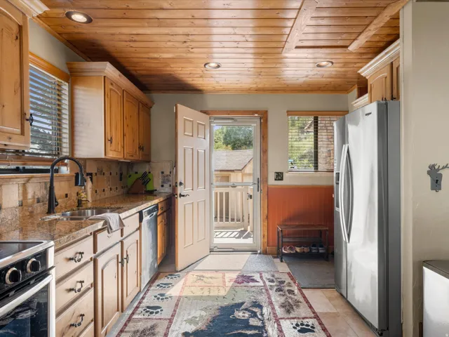 Wood-paneled ceiling with recessed lighting