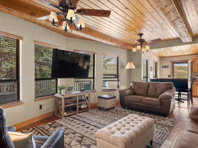 Wood-plank ceiling with exposed beams