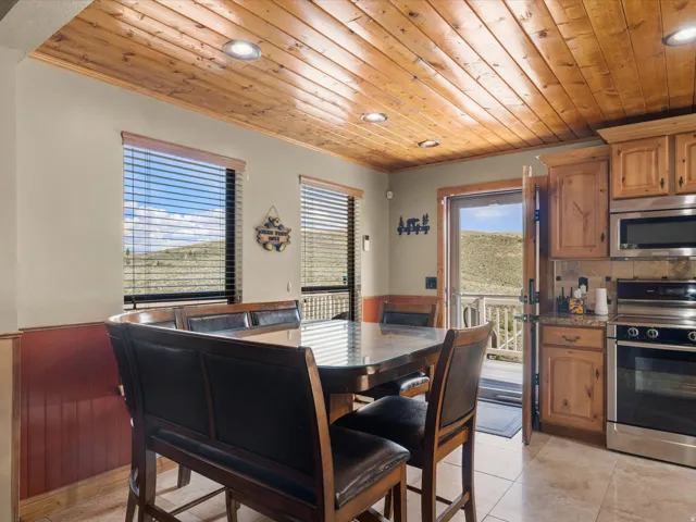 Wood plank ceiling with recessed lighting