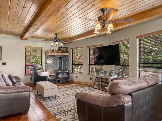 Wood-finish flooring with exposed wood beam ceiling