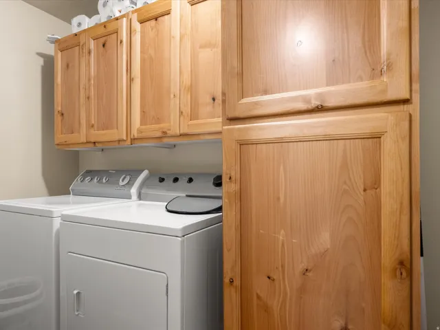Light wood-finish cabinetry providing ample storage