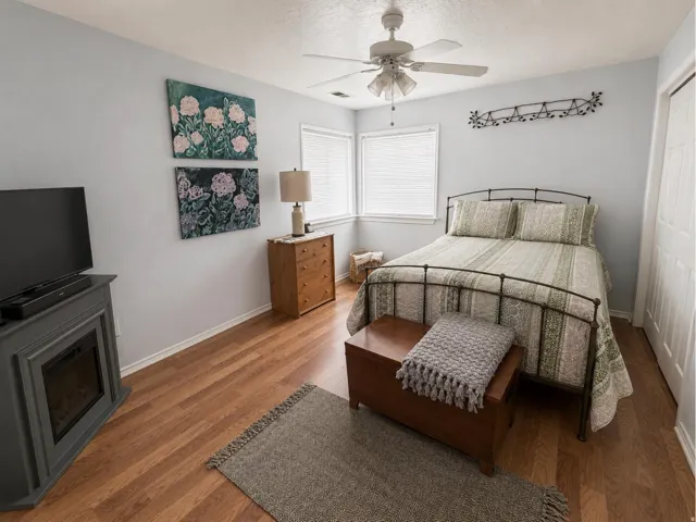 Wood-finish flooring, ceiling fan, and built-in electric fireplace