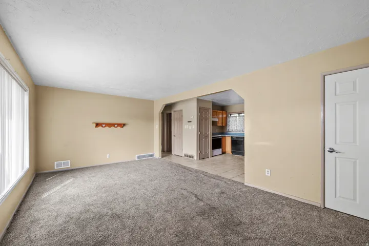 Wall-to-wall carpeting and neutral wall paint