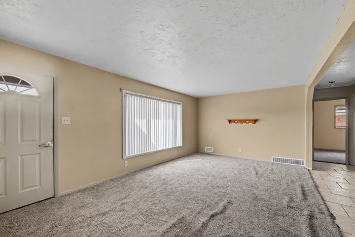 Wall-to-wall carpeting with neutral wall tones