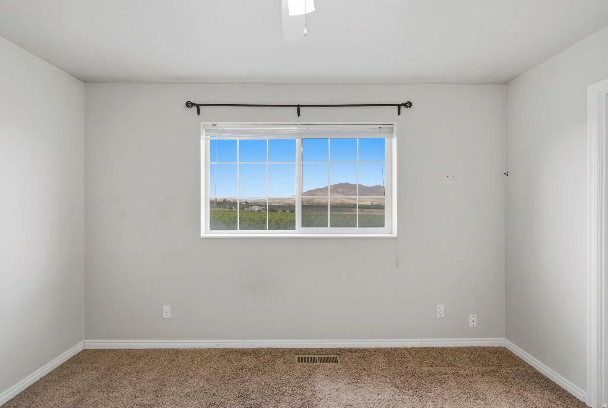 Expansive window with mountain and landscape scenery