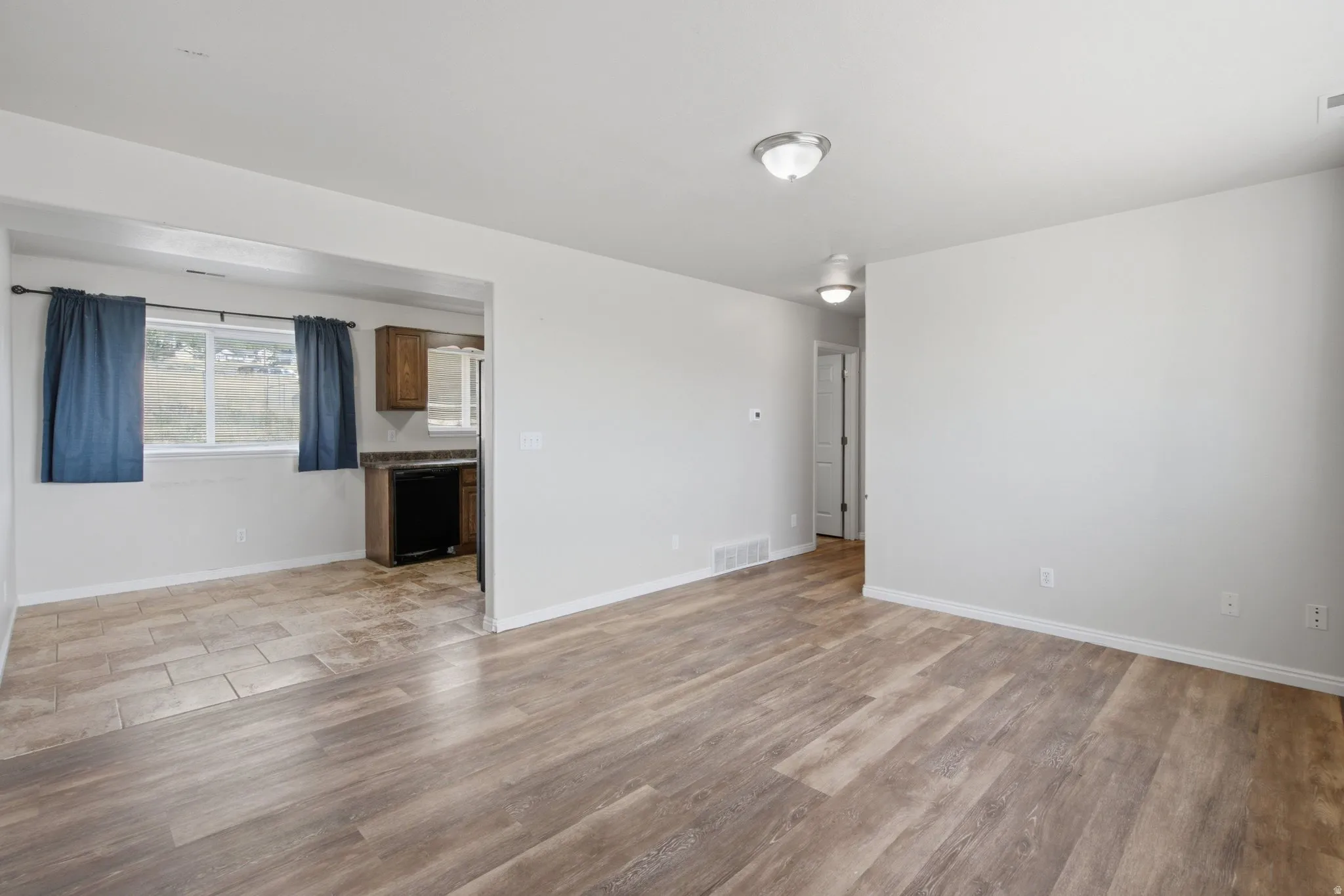 Wood-finish flooring throughout the main living space