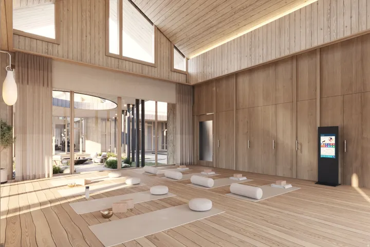 Vaulted wood-paneled ceiling with clerestory windows, wood-finish flooring, extensive wood-paneled walls, and a large glazed opening