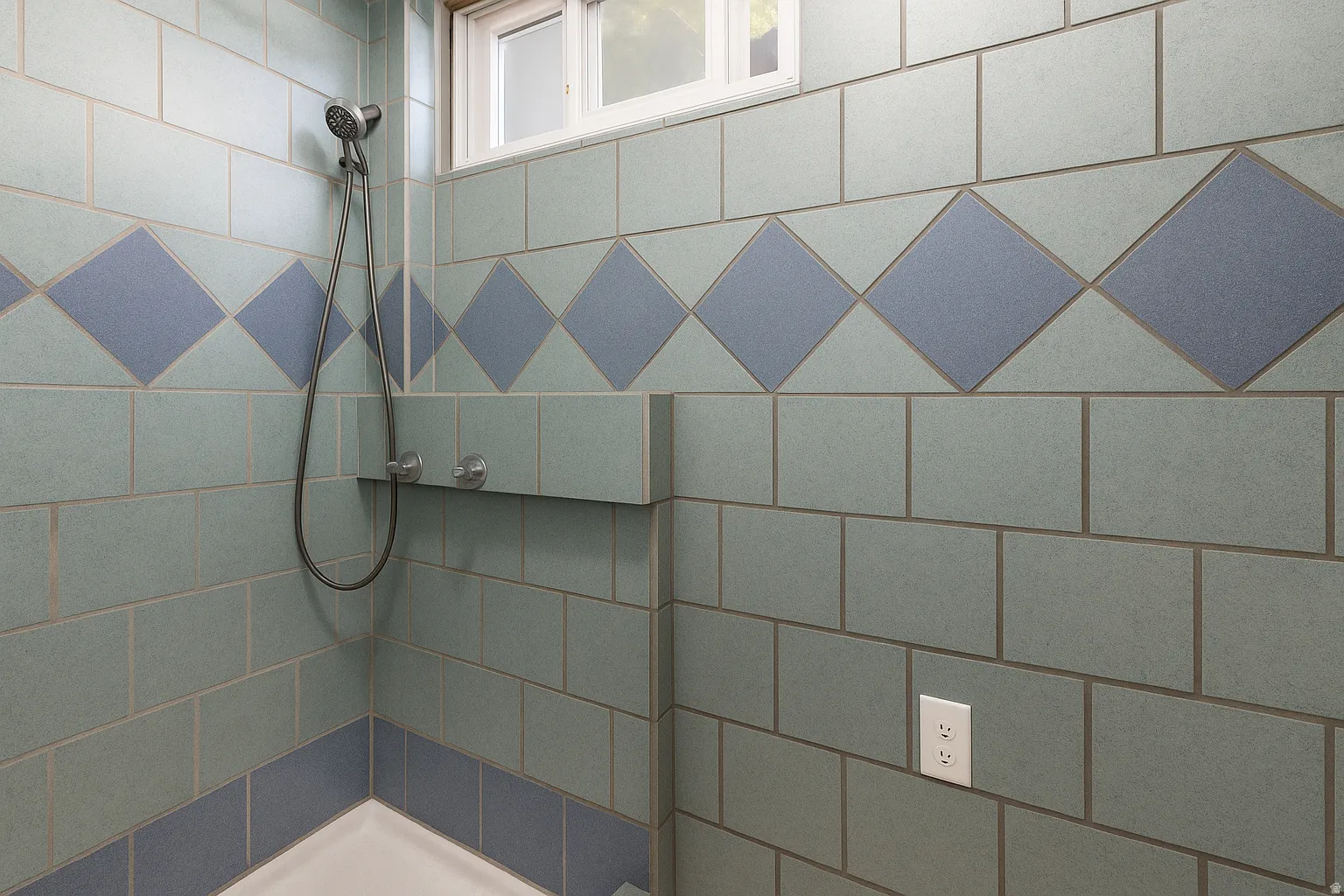Tiled shower with a decorative accent band and built-in shelf