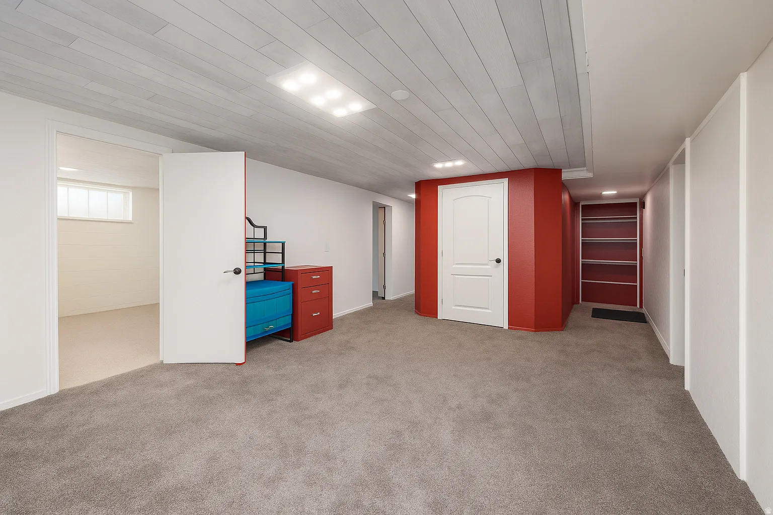 Grey carpet flooring, white plank ceiling, recessed lighting, white walls, and built-in shelving