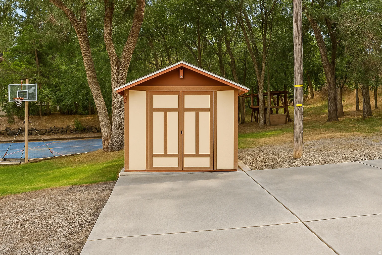 Gable-roof storage shed with light-toned siding and brown trim
